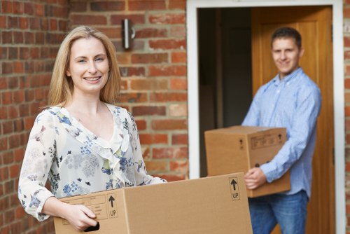 Moving boxes and furniture prepared for urgent collection in a St Johns Wood property