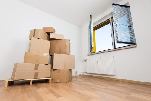 Trained movers using PPE during a careful relocation job